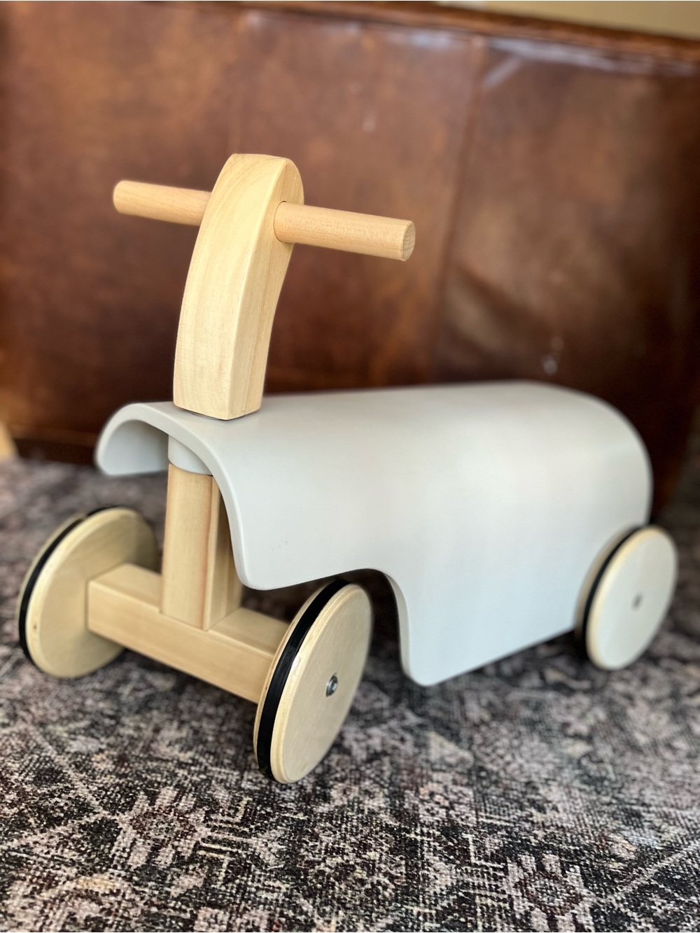 Wooden Ride-On Toy with Light Gray Seating